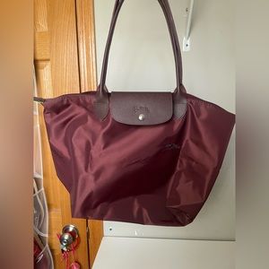 Brand new large Longchamp tote. Never been used. Beautiful fall color.